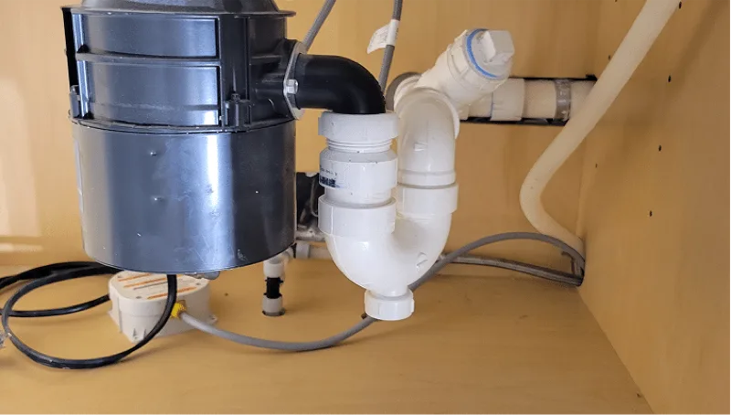 Plumbing repair under a kitchen sink